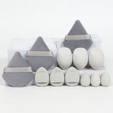 Kit with 12 triangular makeup sponges. Perfect for applying foundation, powder, and liquids with an even finish